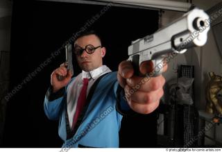 MIKAEL BLUESPY WITH TWO GUNS